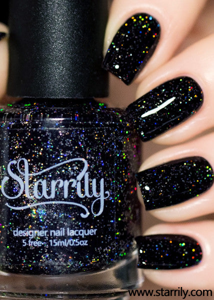 Neutrino is a jet black nail polish with bright silver holographic glitter