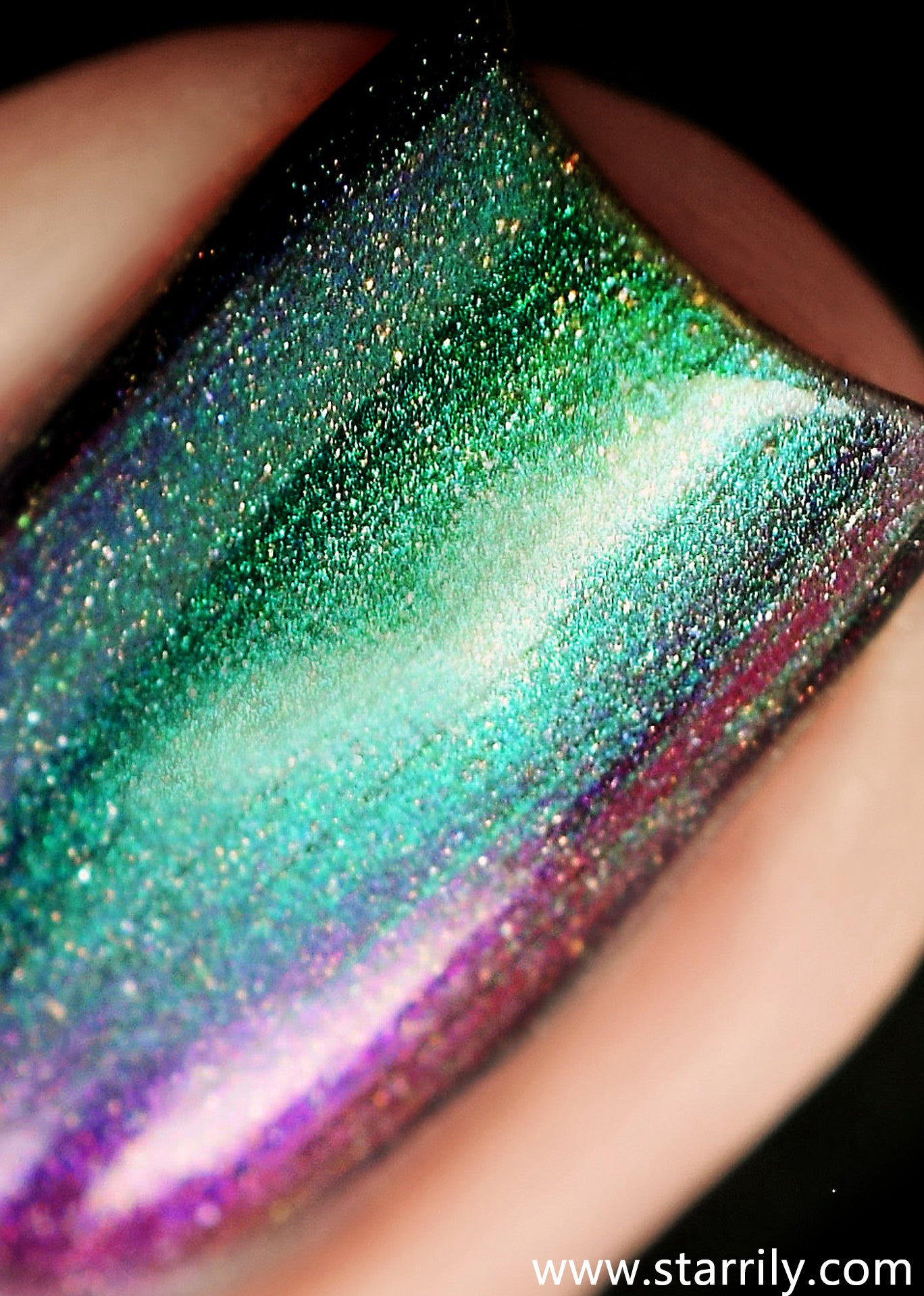 Starrily Aurora - Jaw dropping green to purple color changing holographic multi chrome. High quality nail polish. Made in the USA! Cruelty Free and Vegan.