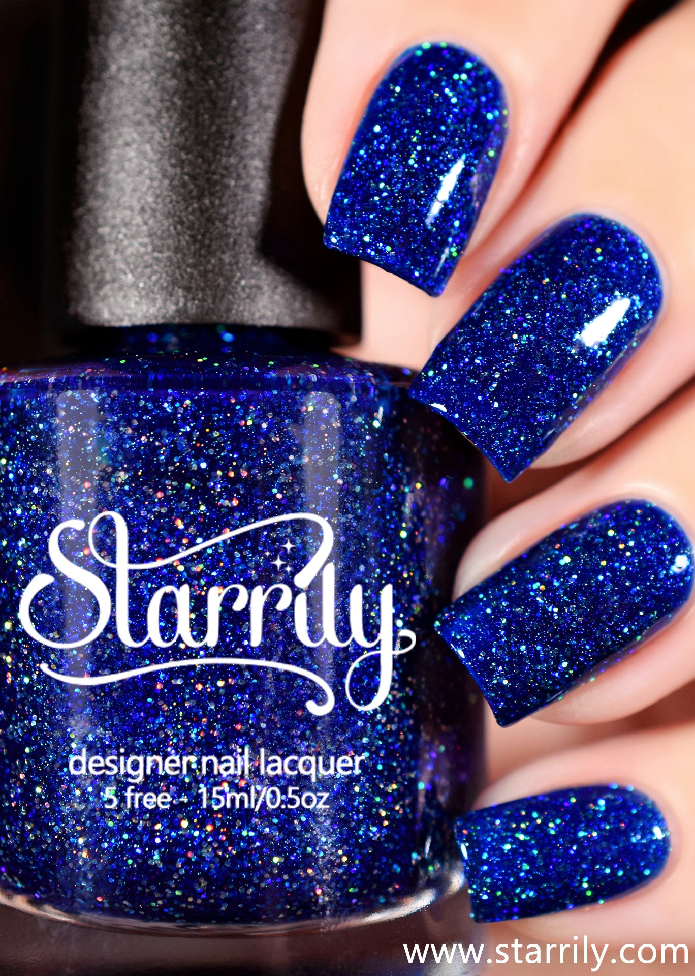 Starrily Bioluminescence - Rich sapphire blue with holographic glitter and a holo effect. High quality nail polish. Made in the USA! Cruelty Free and Vegan.