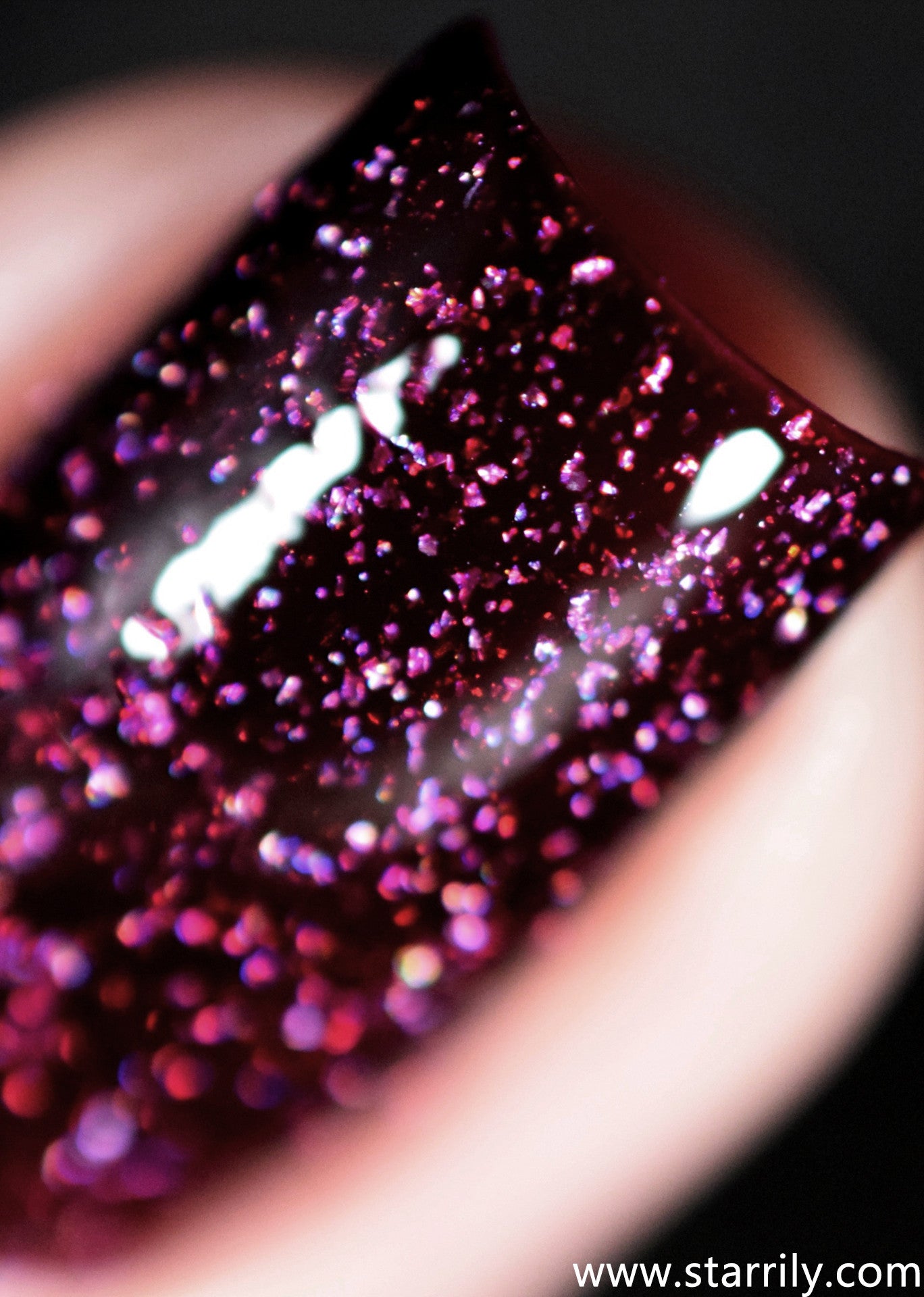 Oxytocin is a beautiful dark red maroon nail polish with holographic flakes