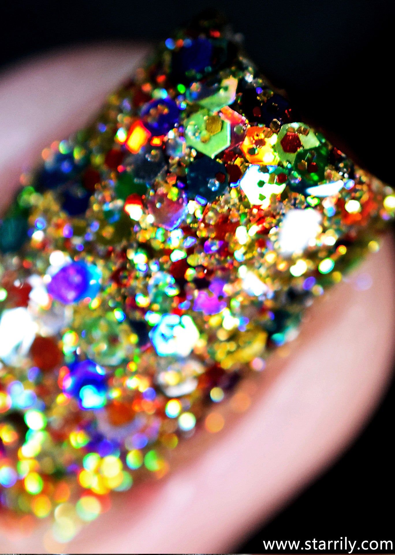 Christmas Lights is a nail polish jam packed with golden and rainbow colored glitters