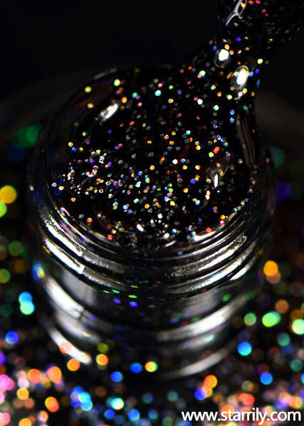 Neutrino is a jet black nail polish with bright silver holographic glitter