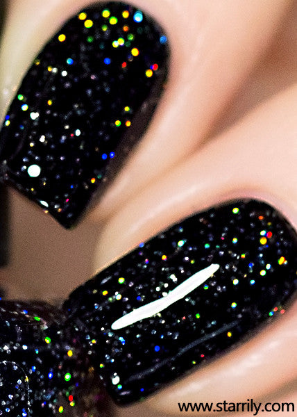 Neutrino is a jet black nail polish with bright silver holographic glitter