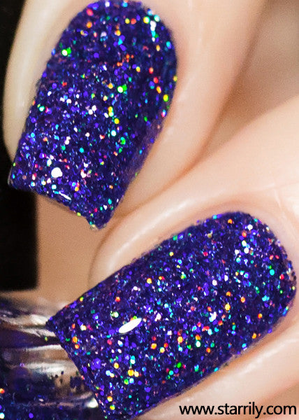 Orions Belt is a stunning nail polish containing sparkling purple holographic glitter