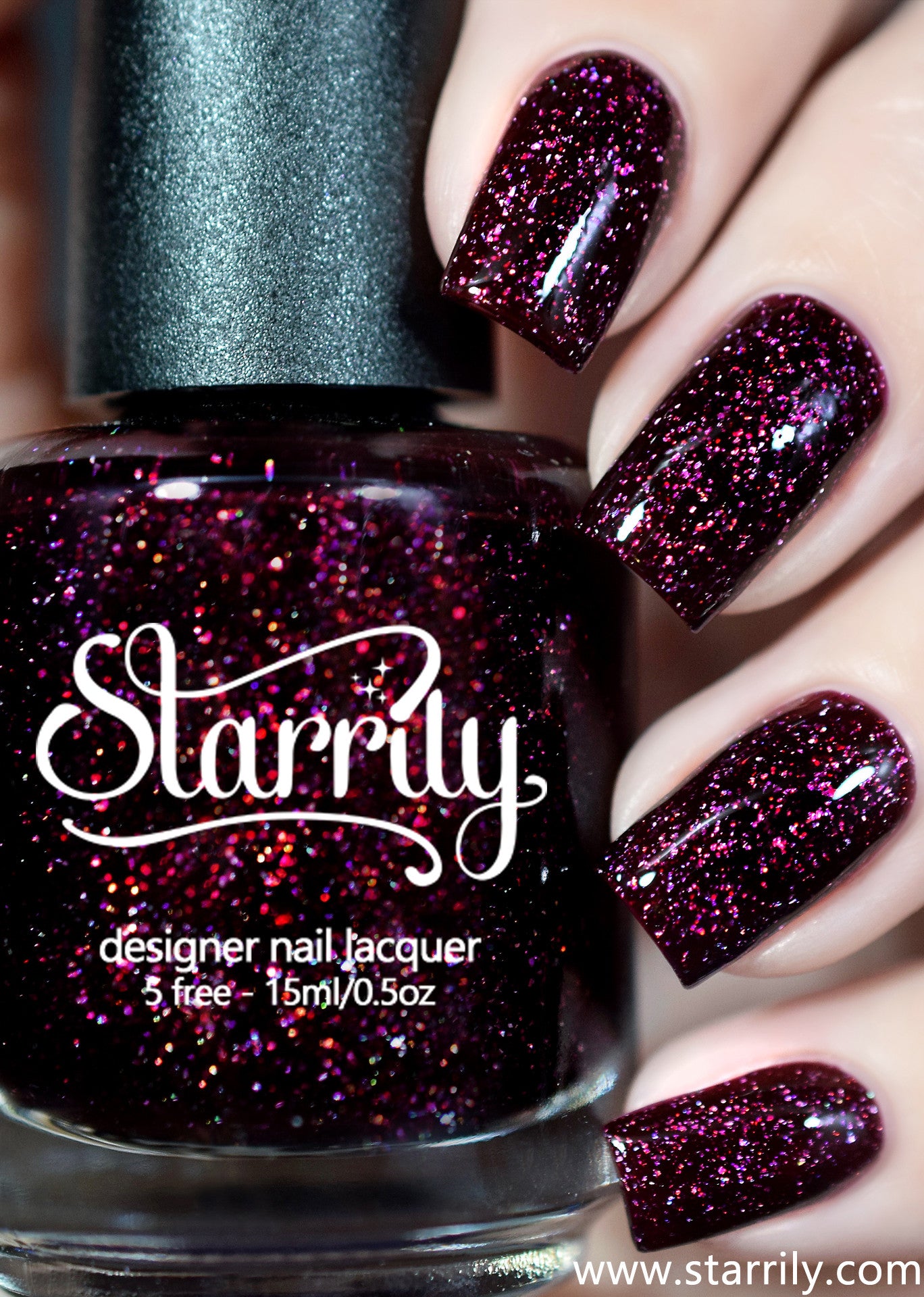 Oxytocin is a beautiful dark red maroon nail polish with holographic flakes