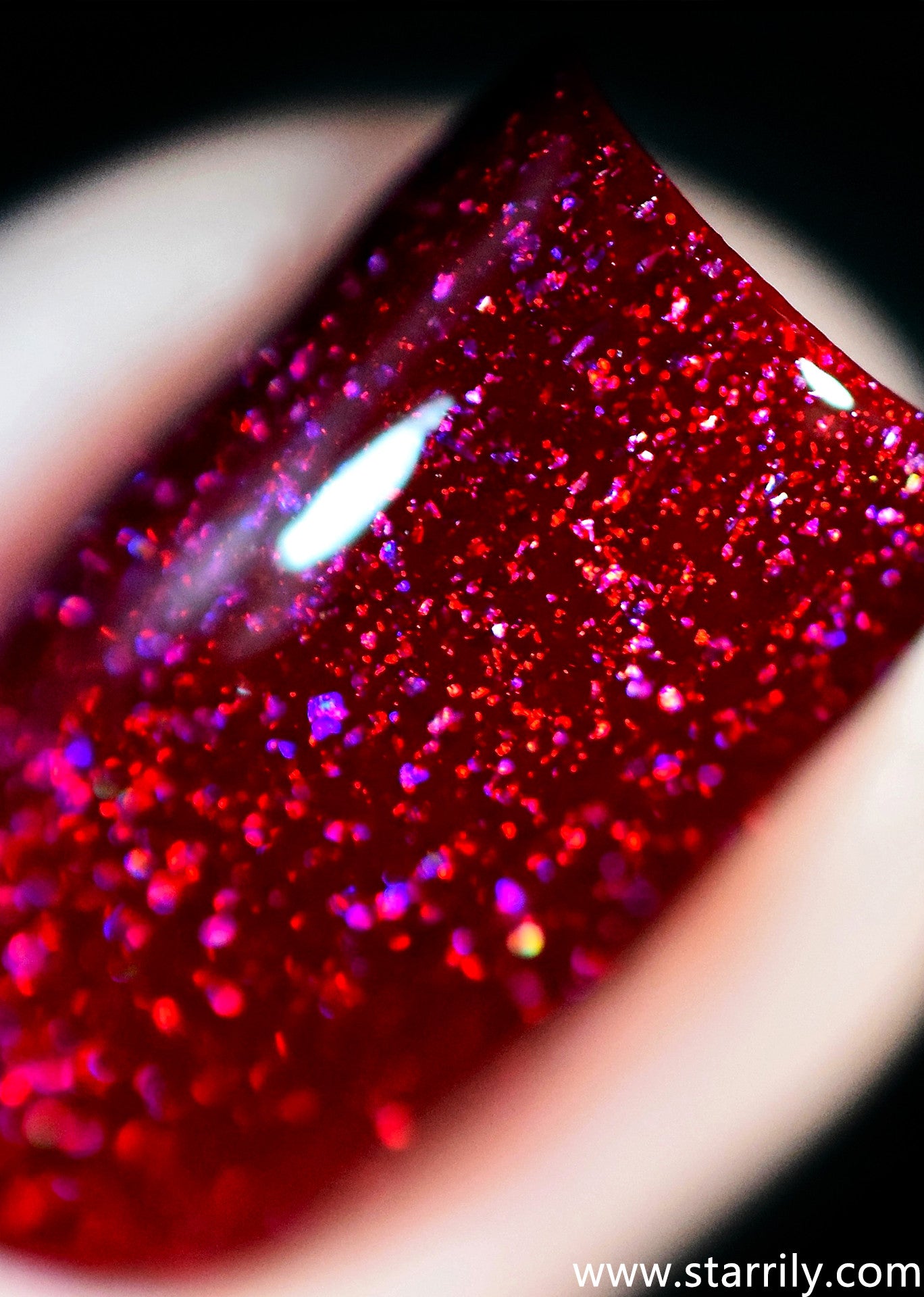 Serotonin is an amazing red jelly nail polish with holographic flakes