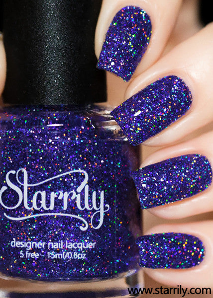Orions Belt is a stunning nail polish containing sparkling purple holographic glitter